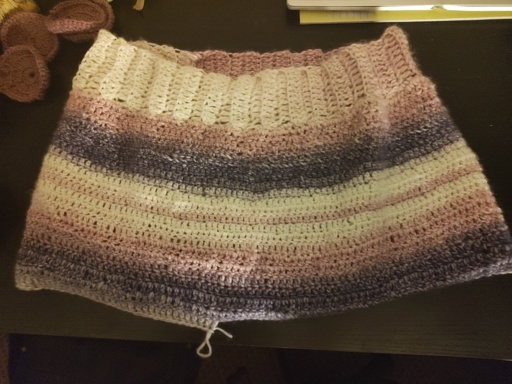 Purple/pink/white crocheted skirt.